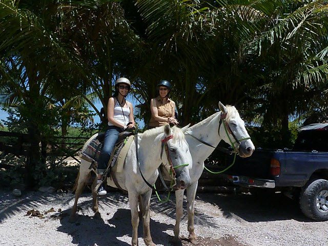 Caren and daughter horseback